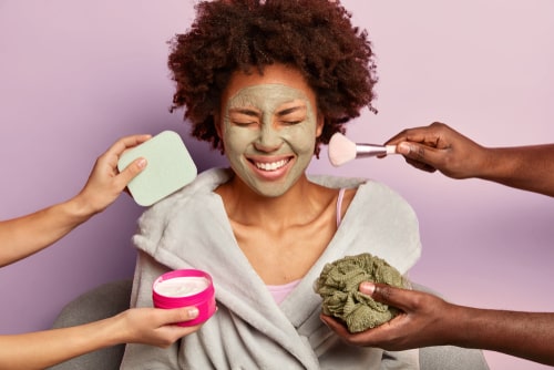 Women with closed eyes in front of the cosmetics tools